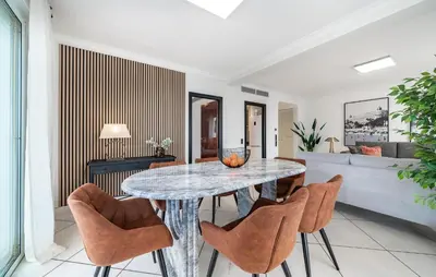 a dining room with a table and chairs at 2 Bedroom Cozy Apartment In Cannes in Cannes