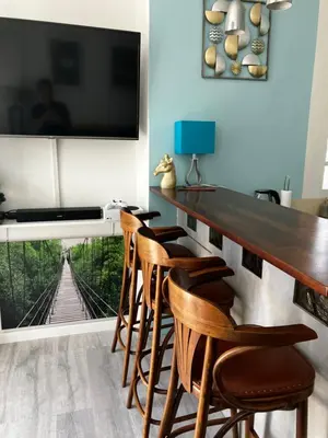 a dining room with a wooden table and chairs at Cannes Sweet Cannes in Cannes