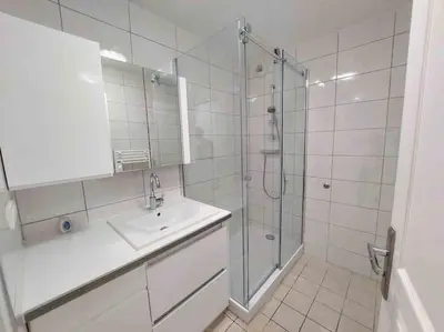 a bathroom with a sink and a shower at Modern one bedroom apartment in Cannes in Cannes