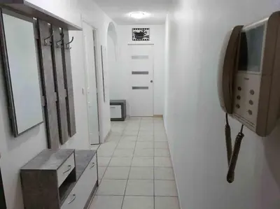 a bathroom with a sink and a tv on a wall at Modern one bedroom apartment in Cannes in Cannes