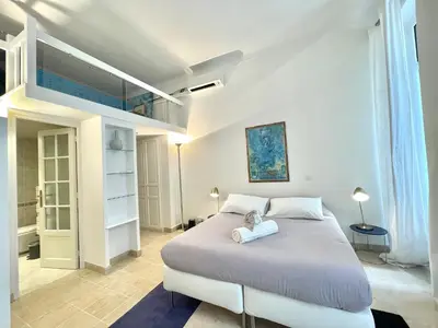 a bedroom with a large white bed in a room at Marina Luxury 3 bedroom by Welcome to Cannes in Cannes