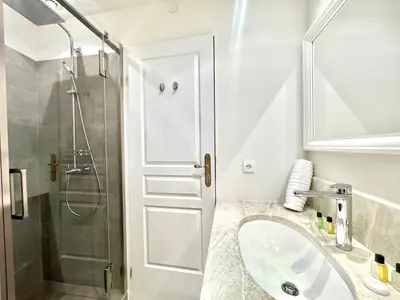 a bathroom with a sink and a shower at Marina Luxury 3 bedroom by Welcome to Cannes in Cannes