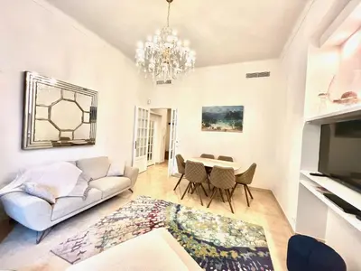 a living room with a couch and a table at Marina Luxury 3 bedroom by Welcome to Cannes in Cannes