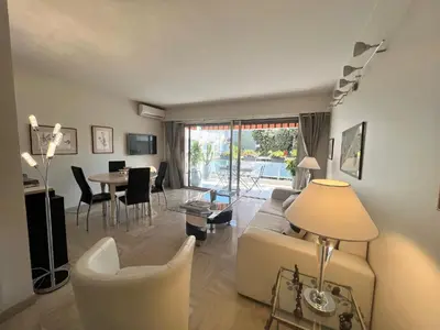 a living room with a couch and a table at Alexandra apartment by Welcome to Cannes in Cannes