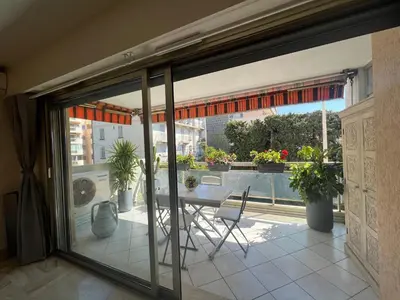 a view of a balcony from a room with sliding glass doors at Alexandra apartment by Welcome to Cannes in Cannes