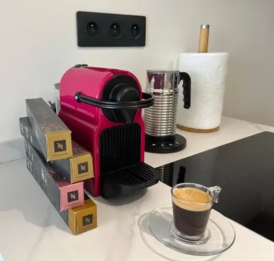 a coffee maker and a cup of coffee on a counter at Parc Montfleury in Cannes