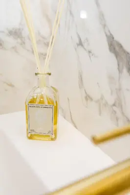 a bottle of essential oils sitting on a counter at Luxueux 3p. Art Deco + Parking in Cannes
