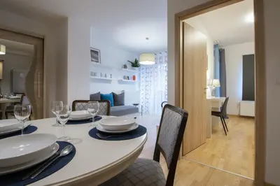 a dining room with a white table and chairs at ID 388 to be removed in Cannes