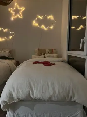 a bedroom with a white bed with stars on the wall at Horizon Bay - Pool - Fitness Room - Terrace in Cannes