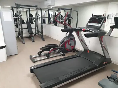 a gym with a treadmill and other exercise equipment at Horizon Bay - Pool - Fitness Room - Terrace in Cannes