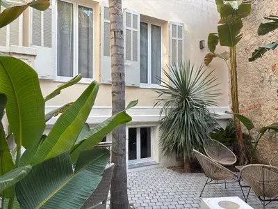 a kitchen counter with a sink and a mirror at Villa les fougeres suite festival jardin garage in Cannes