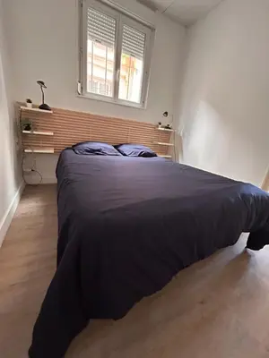 a bedroom with a large bed in a room at CANNES RIVAGE bord de mer in Cannes
