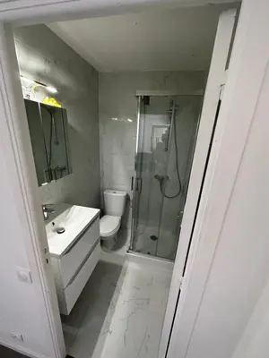 a bathroom with a shower and a toilet and a sink at Magnifique appartement in Cannes