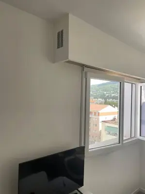 a white wall with a window in a room at Magnifique appartement in Cannes