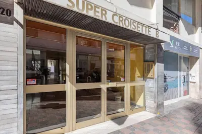 a store front with glass doors on a building at Appartemet a Cannes/Plage/Centre in Cannes
