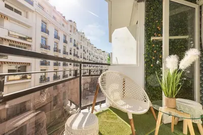 a balcony with two chairs and a window at Appartemet a Cannes/Plage/Centre in Cannes
