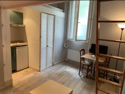 a small room with a desk and a computer in it at Grand studio centre Cannes in Cannes