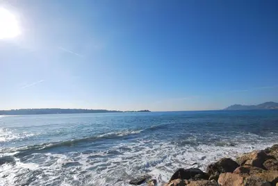 a view of the ocean from a rocky beach at CROISETTE AZUR ONE BEDROOM APARTMENT WITH TERRACE in Cannes
